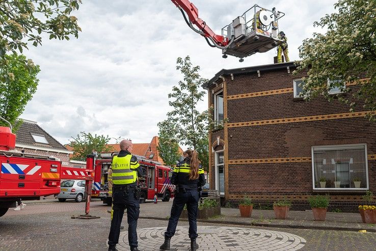 Schoorsteenbrand in woning Assendorp - Foto: Peter Denekamp