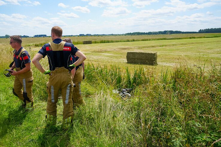 Vrouw met scootmobiel te water onder de rook van Zwolle, gered door passerende fietser